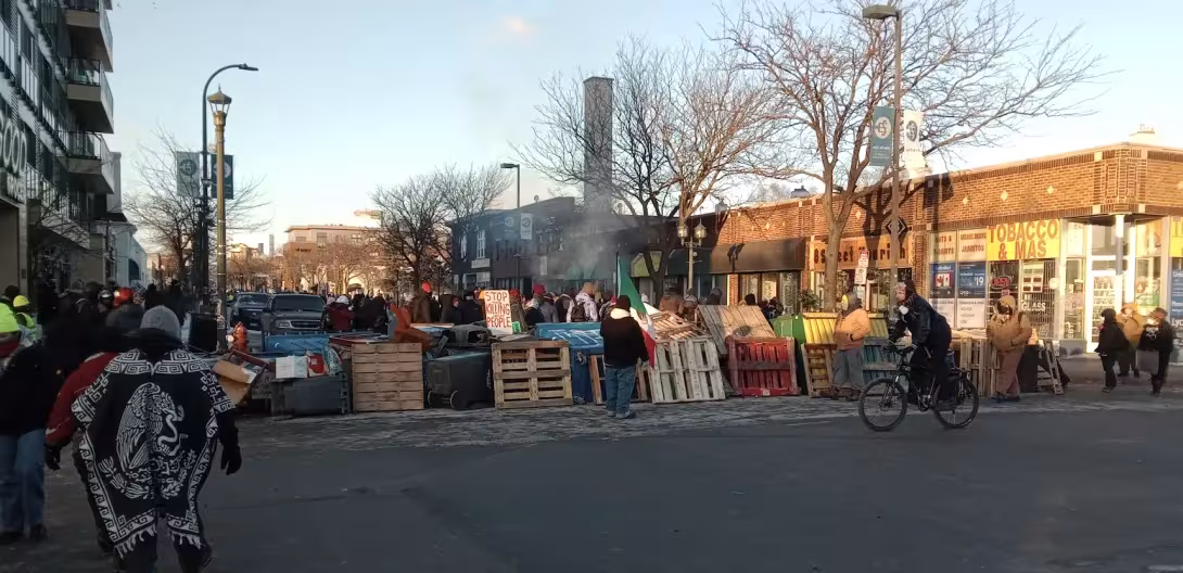 A barricade stretches across a winter Minneapolis street